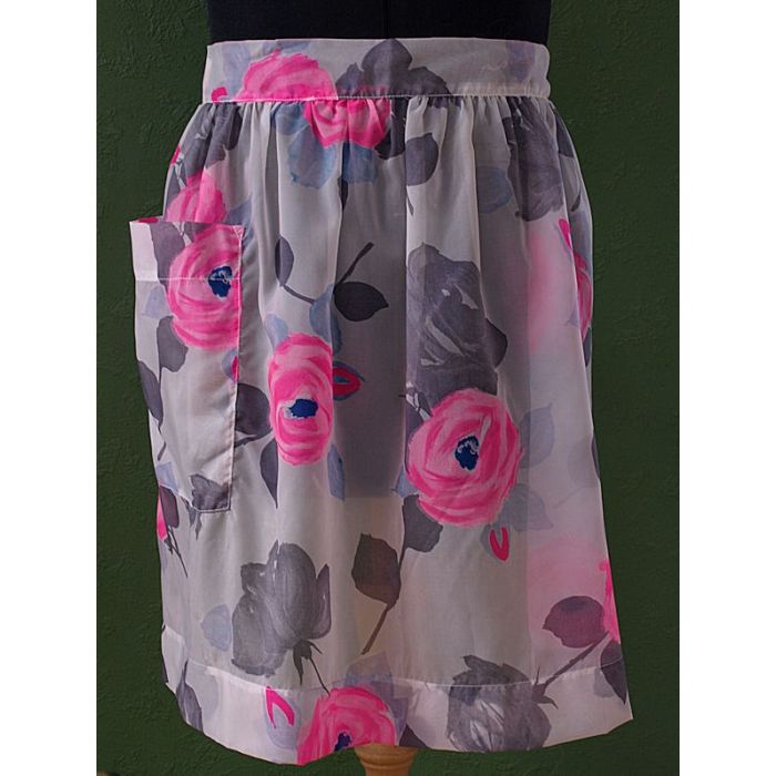 Vintage forklæde med blomstermotiver, aldrig brugt. Fra 60erne.