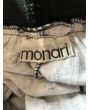 Sort vintage nederdel med hvidt mønster fra Monari, logo