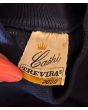 Marineblå vintage bluse med turtleneck, fra Cashi. Str. 36/38, logo
